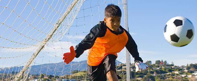 Child playing soccer.