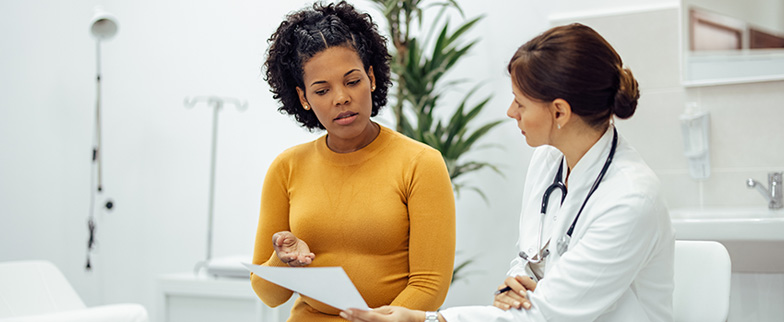 Woman talking to her doctor.