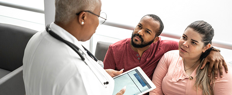 Couple getting a second opinion from doctor.